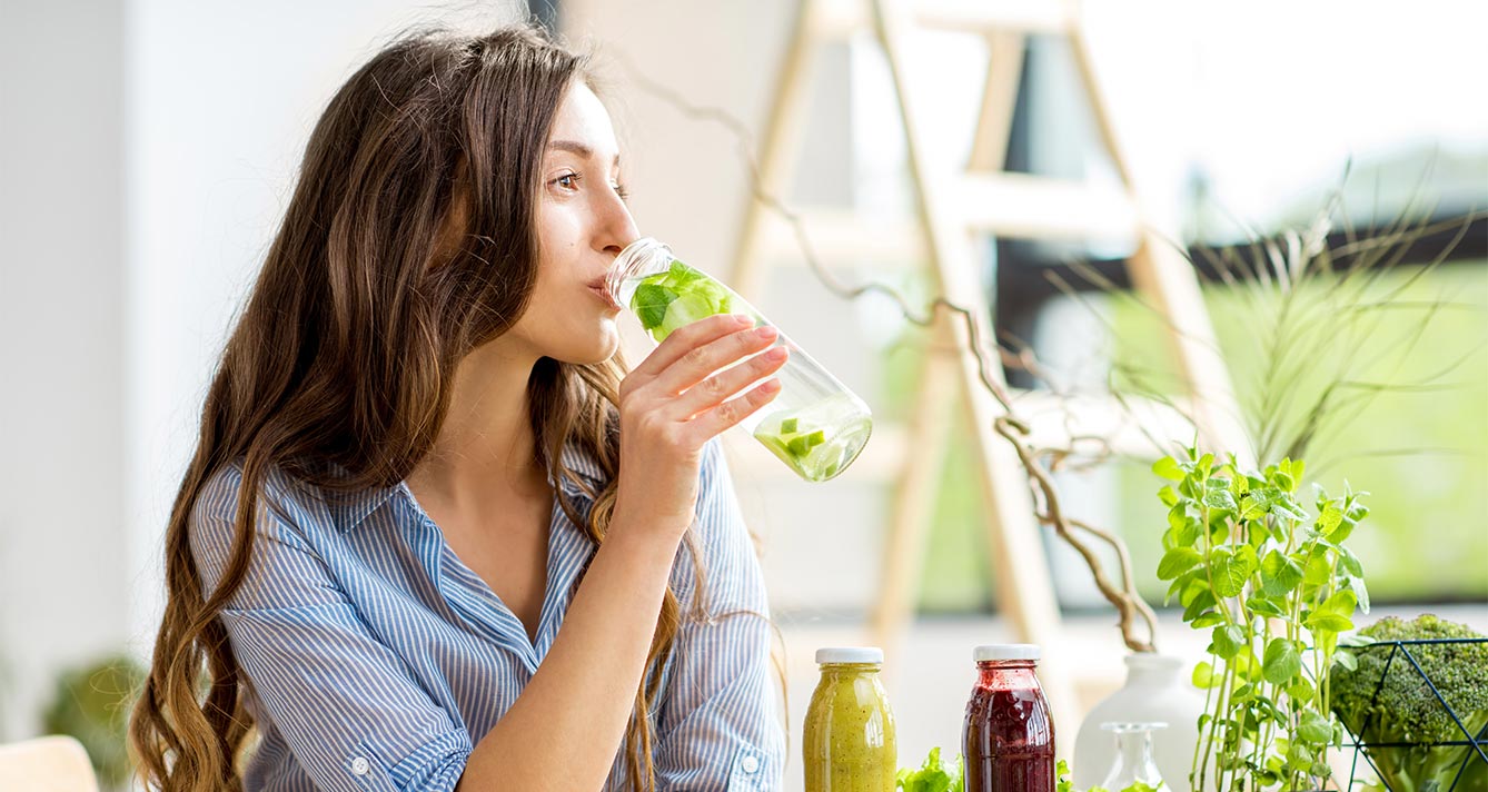 Woman drinking healthy water and smoothies