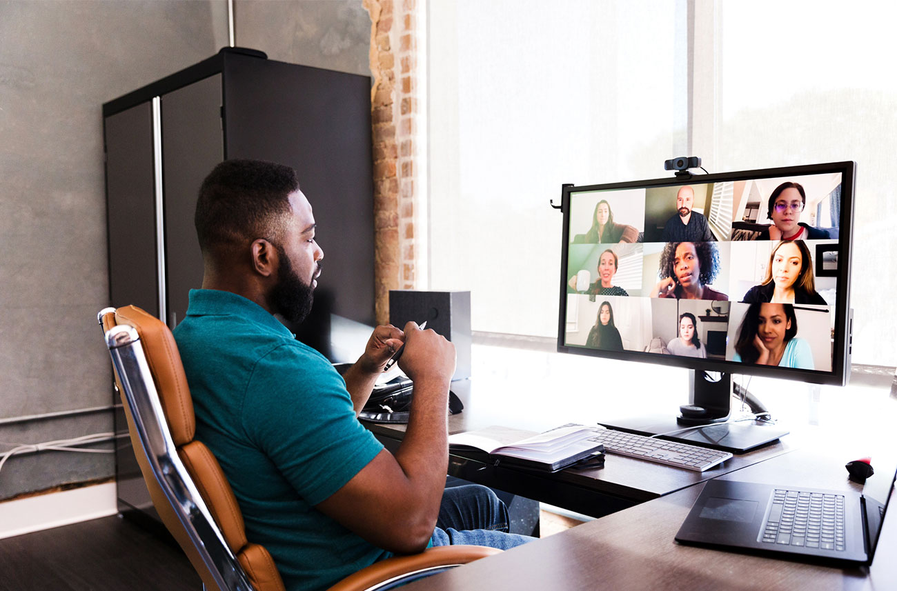 man working from home having a video conference