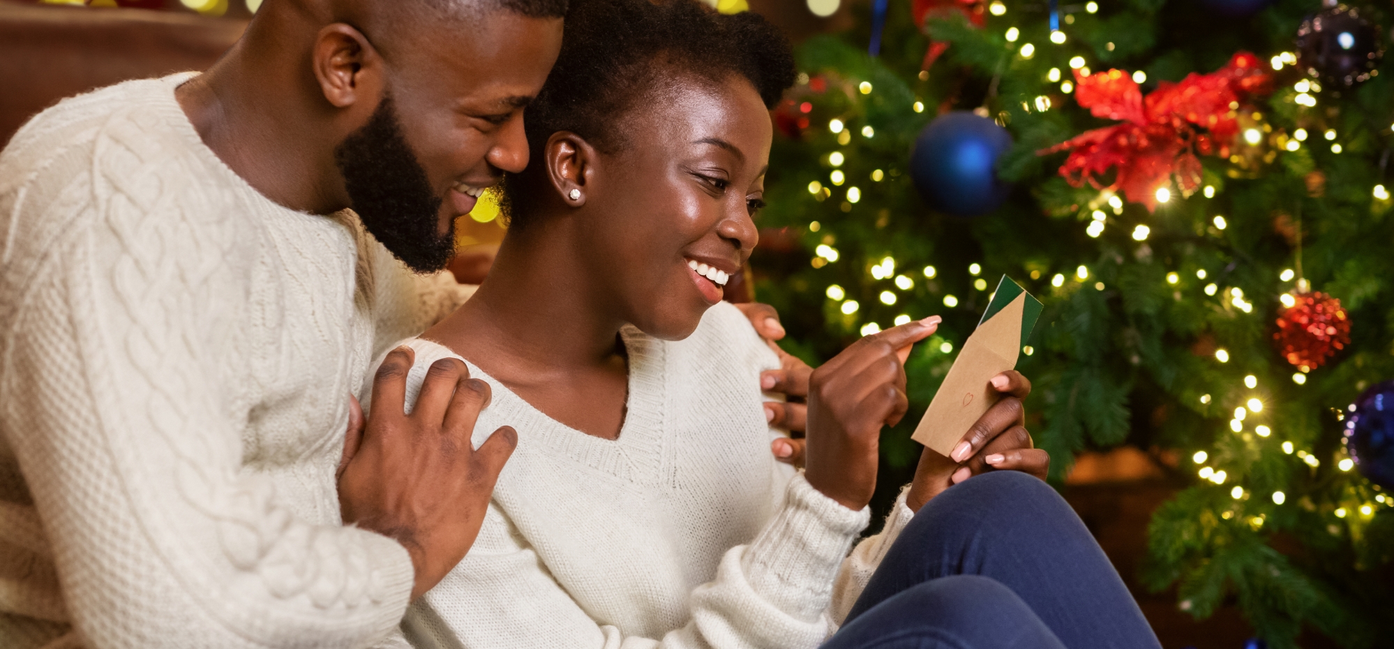 Couple opening christmas cards