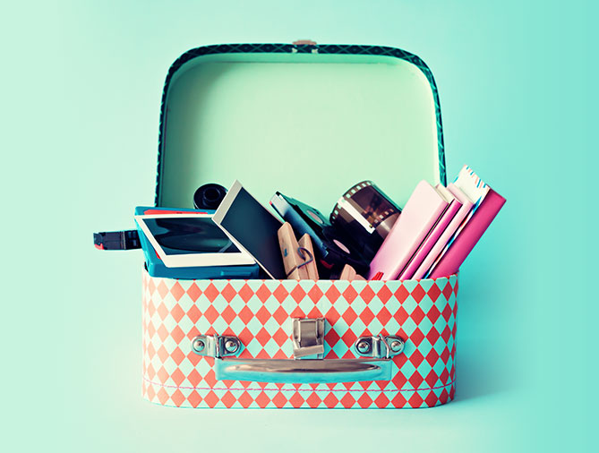 Tin lunch box with notebooks and photography supplies