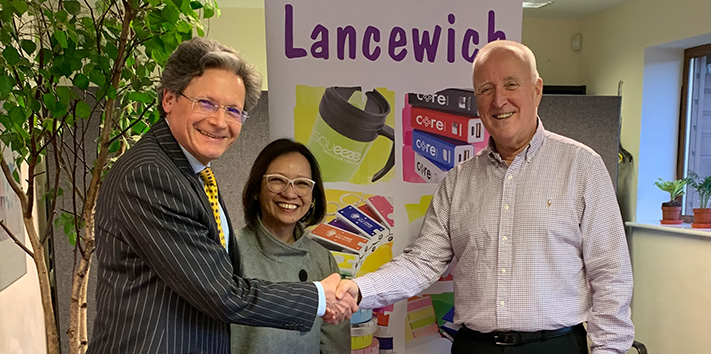 Nicholas Martin and Jessie Wong of Lancewich shake hands with Frank Murphy of GeigerBTC