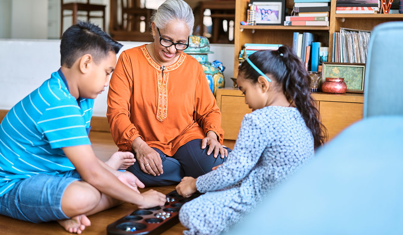 family playing board game together