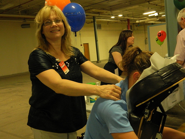 Massage therapist at healthcare event